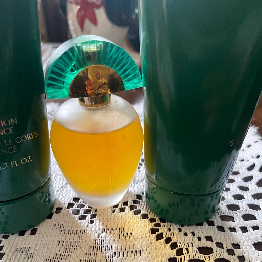 Avon Rare Emeralds 1.7 Oz spray never used with two matching body lotions.  T